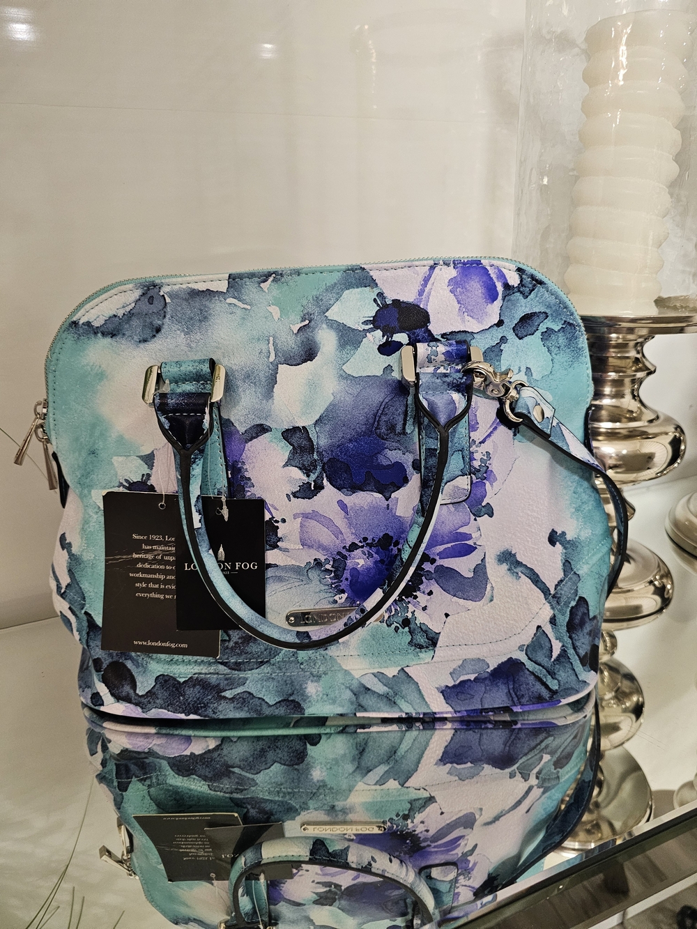 London Fog Floral Satchel in Teal, Blue, Purple, white.